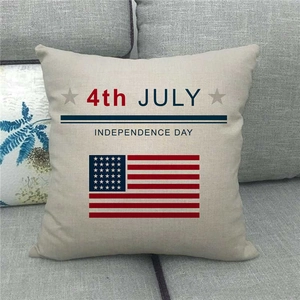 Linen Independence Day pillow cover with 4th July stars on a grey fabric sofa