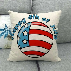 Detail of Fourth of July linen pillowcase featuring flag pattern on a gray sofa