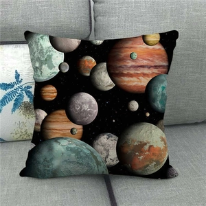 Space galaxy theme linen pillowcase featuring colorful planets on a dark grey sofa