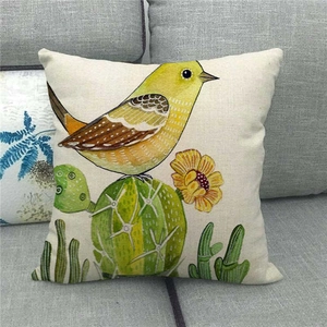 Cute cartoon bird and cactus linen throw pillow cover on a grey sofa for home decor