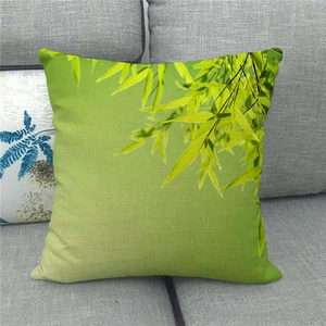 Bamboo leaf ink painting linen pillowcase on a sofa with natural green leaf pattern