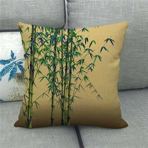 Detailed texture of linen pillowcase featuring green bamboo ink painting on yellow base
