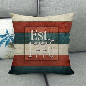 Detail of vintage linen pillow case with red and blue stripes and Est. 1776 print