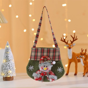 Detail of green felt Christmas gift bag featuring 3D snowman and red plaid accents