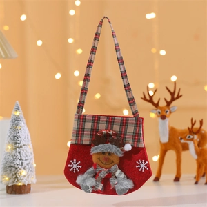 Detailed view of a Christmas non-woven reindeer gift bag with plaid handles and embroidery