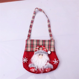 Detailed close-up of a Christmas candy bag with 3D Santa Claus and red plaid handles