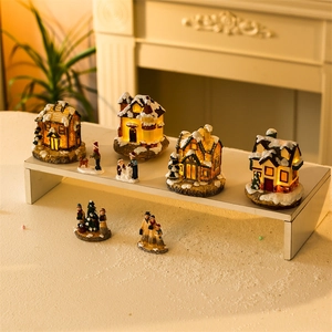 Lighted Christmas village house set with miniature figures and warm LED snow cottages