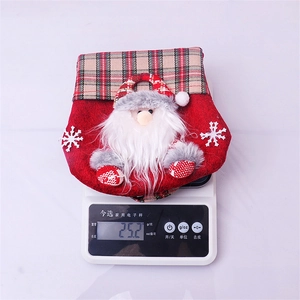 Detail view showing 25.2g weight of red non-woven Christmas candy bag on a digital scale