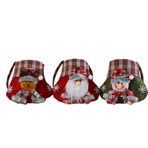 Three Christmas non-woven gift bags featuring Santa, Reindeer, and Snowman with plaid handles