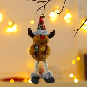 Detail of plush reindeer Christmas ornament with wood beads and bells on a tree