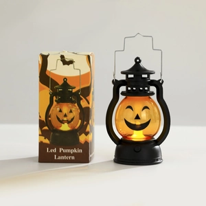Détail de la lanterne citrouille LED style lampe à huile avec sa boîte d'emballage