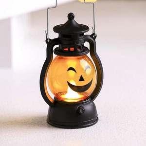 Lanterne LED citrouille d'Halloween avec lueur orange et cadre noir pour fêtes