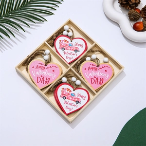 Macro detail of Valentine's wooden heart ornaments in a four-grid storage box