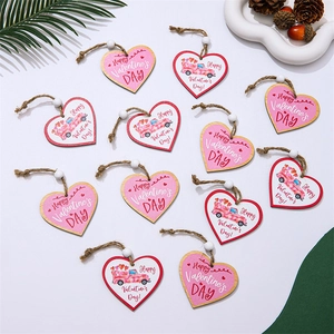 Detail of heart-shaped wooden Valentine's ornaments with pink truck and text in a gift box
