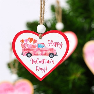 Macro shot of wooden heart-shaped Valentine ornament with pink truck print and twine