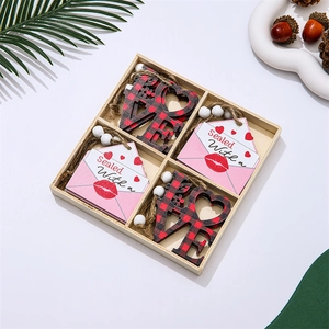 Close-up of wooden Valentine ornaments with red-black plaid heart and love letter charms