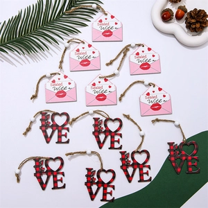 Detail of wooden Valentine heart pendants with envelope designs and twine in a 4-grid layout