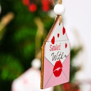Detail of wooden envelope ornament with red hearts and hemp rope for Valentine's day