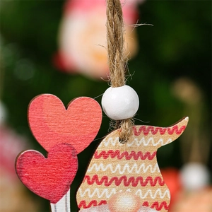 Close-up of heart-shaped wooden pendants with wavy patterns and hemp rope detail