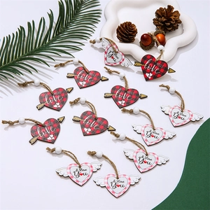 Detail of wooden heart ornaments with buffalo plaid and twine in a natural festive setting