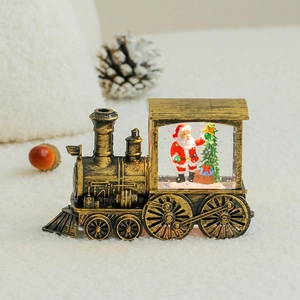 Vintage bronze Christmas train ornament with Santa Claus and glowing water globe