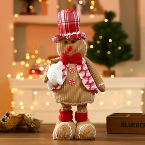 Detail of gingerbread man plush with red checkered hat and festive peppermint buttons