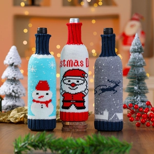 Three-piece knitted Christmas wine bottle covers with Santa and snowman motifs