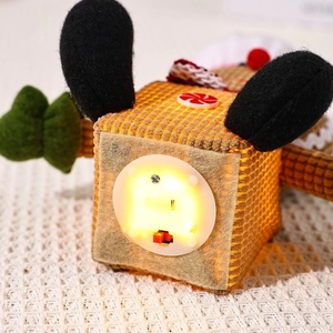 Macro view of the battery pack and warm glowing LED light inside a ginger man plush toy
