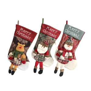 Three Christmas stockings with 3D Santa, Reindeer and Snowman for holiday decoration