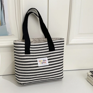 Large striped canvas tote bag with black and white horizontal lines and top handles