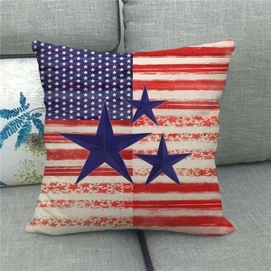 Close-up of linen pillow cover with US flag stripes and 3D blue star design on sofa