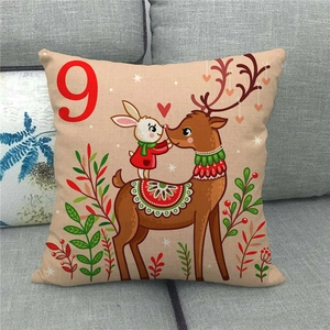 Close-up of linen pillow cover featuring a Christmas deer and rabbit illustration with number 9