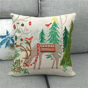 Detailed texture of linen Christmas pillowcase featuring a festive reindeer and snow scene