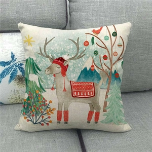 Close-up of linen Christmas pillowcase featuring a cute reindeer with festive trees