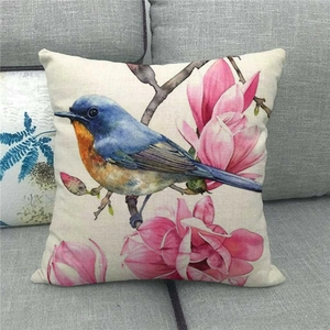 Linen pillowcase with watercolor bird and pink magnolia flowers on beige fabric