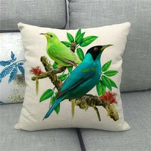 Detailed view of linen cushion cover featuring colorful kingfishers on a floral branch