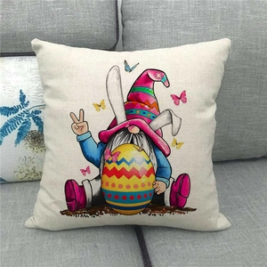 Detail of Easter gnome pillow cover featuring bunny ears and colorful egg on linen fabric