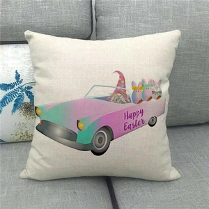 Linen Easter pillowcase detail showing Happy Easter print on a gray fabric sofa