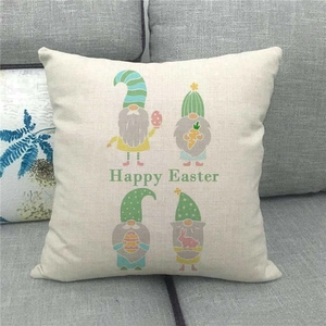 Close-up detail of Happy Easter gnomes printed on a textured beige linen pillowcase