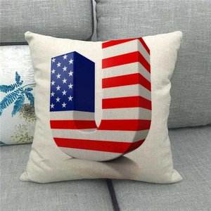 Detail of linen cushion cover with American flag pattern on capital letter U design