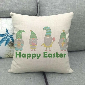 Close-up of Happy Easter linen pillowcase with gnome illustration on a gray sofa