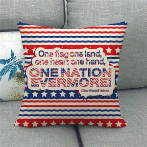 Linen American flag throw pillow cover with Oliver Wendell Holmes quote on gray sofa