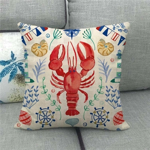 Detailed close-up of nautical pillow cover featuring a red lobster and marine elements