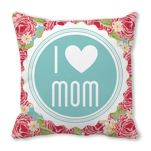 Close-up of peach skin pillowcase featuring red floral patterns and I Love Mom print