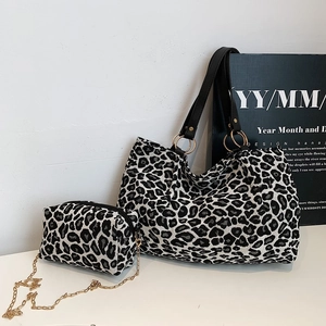 Chic zebra pattern tote bag set with a matching small gold chain crossbody bag