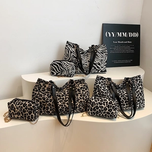 Large leopard and zebra print canvas tote bag with matching zipper pouch and black handles