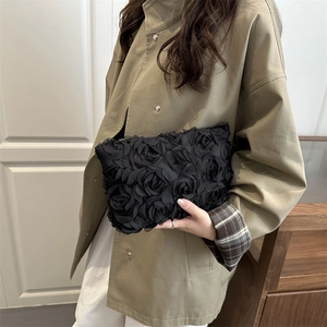 Elegant black evening clutch bag with 3D floral mesh petals and luxury rhinestone details