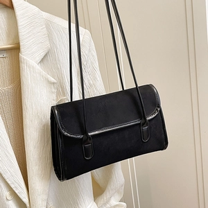 Minimalist black suede shoulder bag with glossy trim and long double straps for women