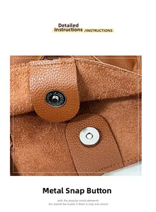 Detail of magnetic hardware clasp on brown lychee grain leather tote bag