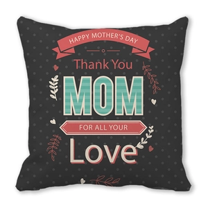 Close-up of peach skin cushion cover with Happy Mother's Day floral print design
